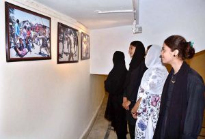 Faculty members and students of Government College Women University Faisalabad (GCWUF) lead a walk to mark Kashmir Black Day.