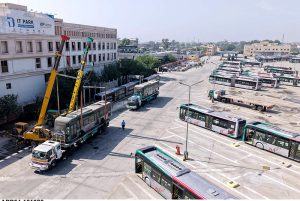 Newly acquired 25 BRT buses are transported by trucks from Karachi Port to the BRT headquarters.
