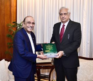 President Asif Ali Zardari receiving a report from Justice Irfan Qadir, Consultant (Legal Affairs) to the President, regarding the disposal of representations from 2024 to 2026, at Aiwan-e-Sadr.