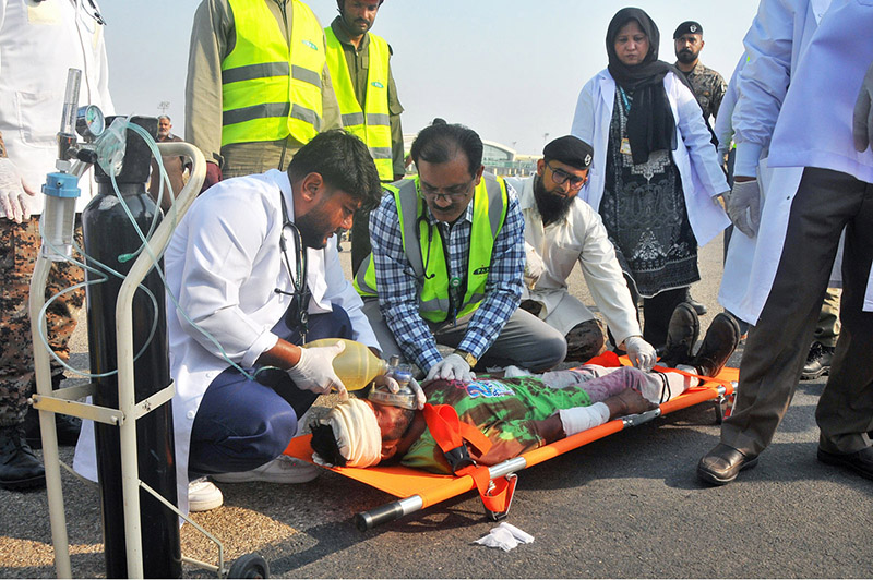 Doctors and emergency medical responders provide critical care, oxygen support, and triage assistance to a simulated casualty during a Full-Scale Emergency Exercise at Multan International Airport. The drill was organized by the Pakistan Airports Authority (PAA) to test inter-agency medical coordination, rapid response times, and life-saving equipment functionality