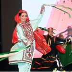 Artists perform a traditional dance during the launch ceremony of the China-Pakistan Information Corridor (CPIC) at the Pakistan-China Friendship Centre