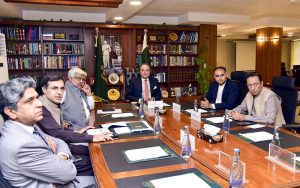 Federal Minister for Finance and Revenue, Senator Muhammad Aurangzeb, chairing a meeting at the Finance Division to review progress on the retailers' tax scheme at the Finance Division.
