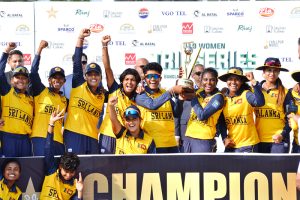 Divisional Commissioner Dr. Imran Hamid Sheikh and Sri Lankan High Commissioner Admiral Fred Seneviratne present the trophy to the captain of the victorious Sri Lanka Under-19 Women’s team after the T20 tri-series final at Iqbal Stadium.