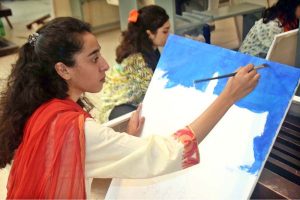 Students take part in painting and drawing activities during art classes at Alhamra Arts Council