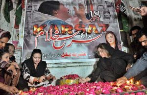 Pakistan People’s Party (PPP) women workers light lamps in memory of the Karsaz tragedy martyrs outside a press club