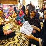 Women activists of the Pakistan People’s Party (PPP) recite the Holy Quran and pay tribute to the martyrs of the Karsaz tragedy