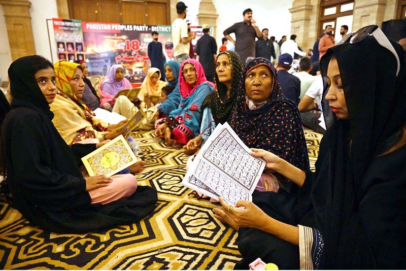 Women activists of the Pakistan People’s Party (PPP) recite the Holy Quran and pay tribute to the martyrs of the Karsaz tragedy