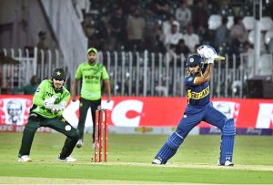 Sri Lankan batter Pavan Rathnayake plays a shot during the Tri-Nation Series cricket match between Pakistan and Sri Lanka at Rawalpindi Cricket Stadium